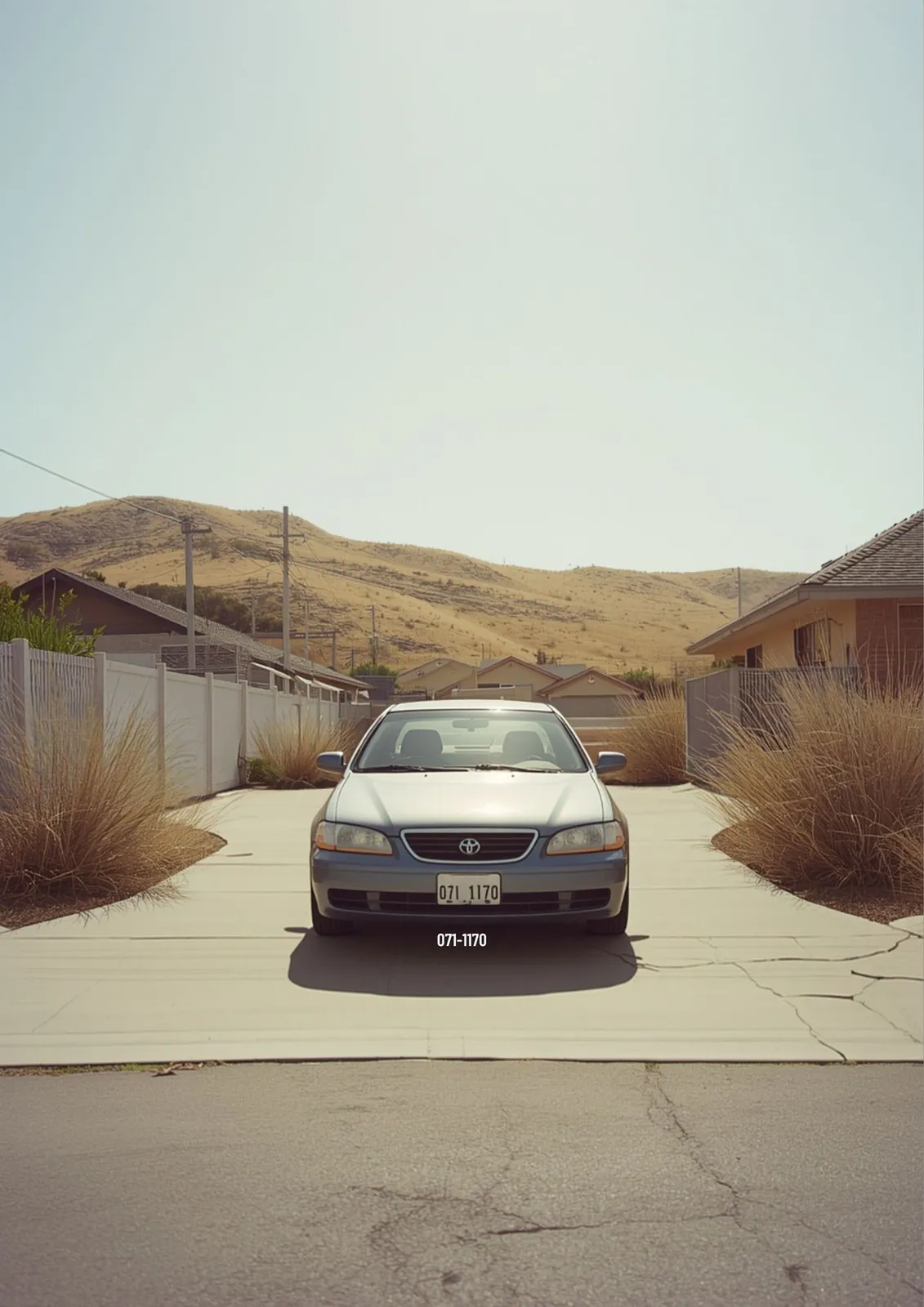 Illustration of a car parked in a driveway in inland San Diego under harsh midday sun, with dry golden hills in the background