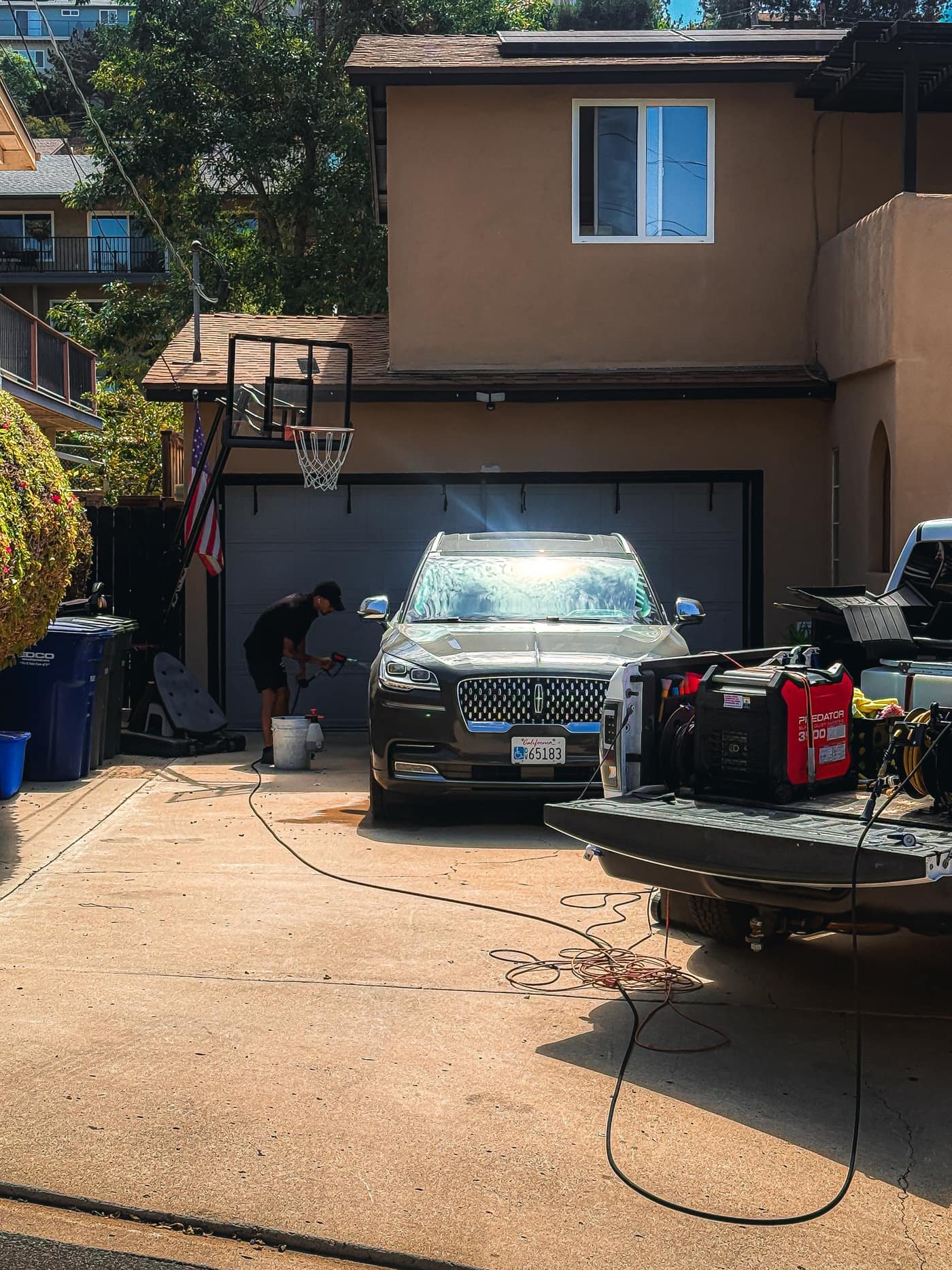 Joji's Mobile Detailing full mobile setup at a customer's driveway in San Diego