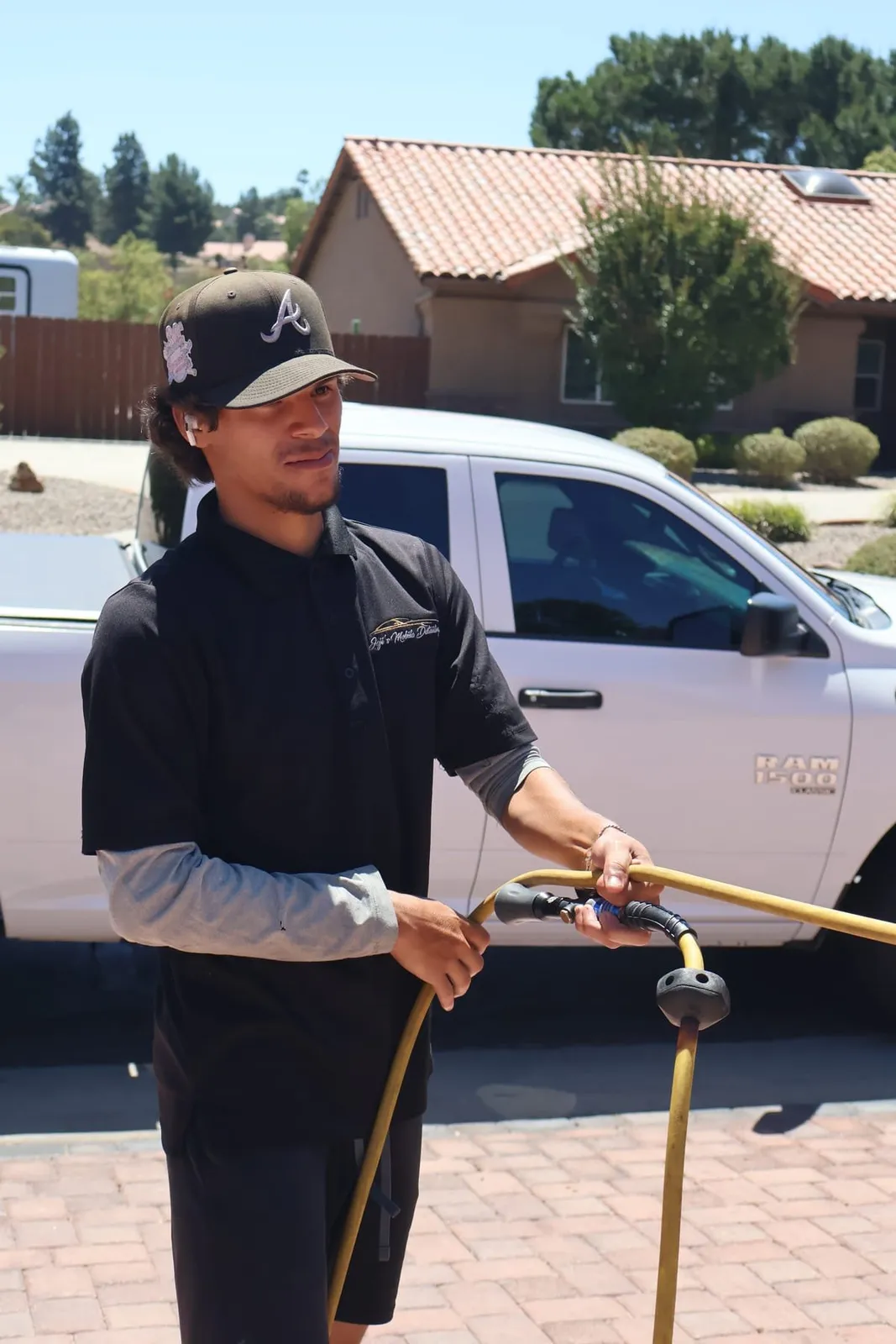 Joji's Mobile Detailing technician on the job in Mission Beach, CA, Joji's Mobile Detailing