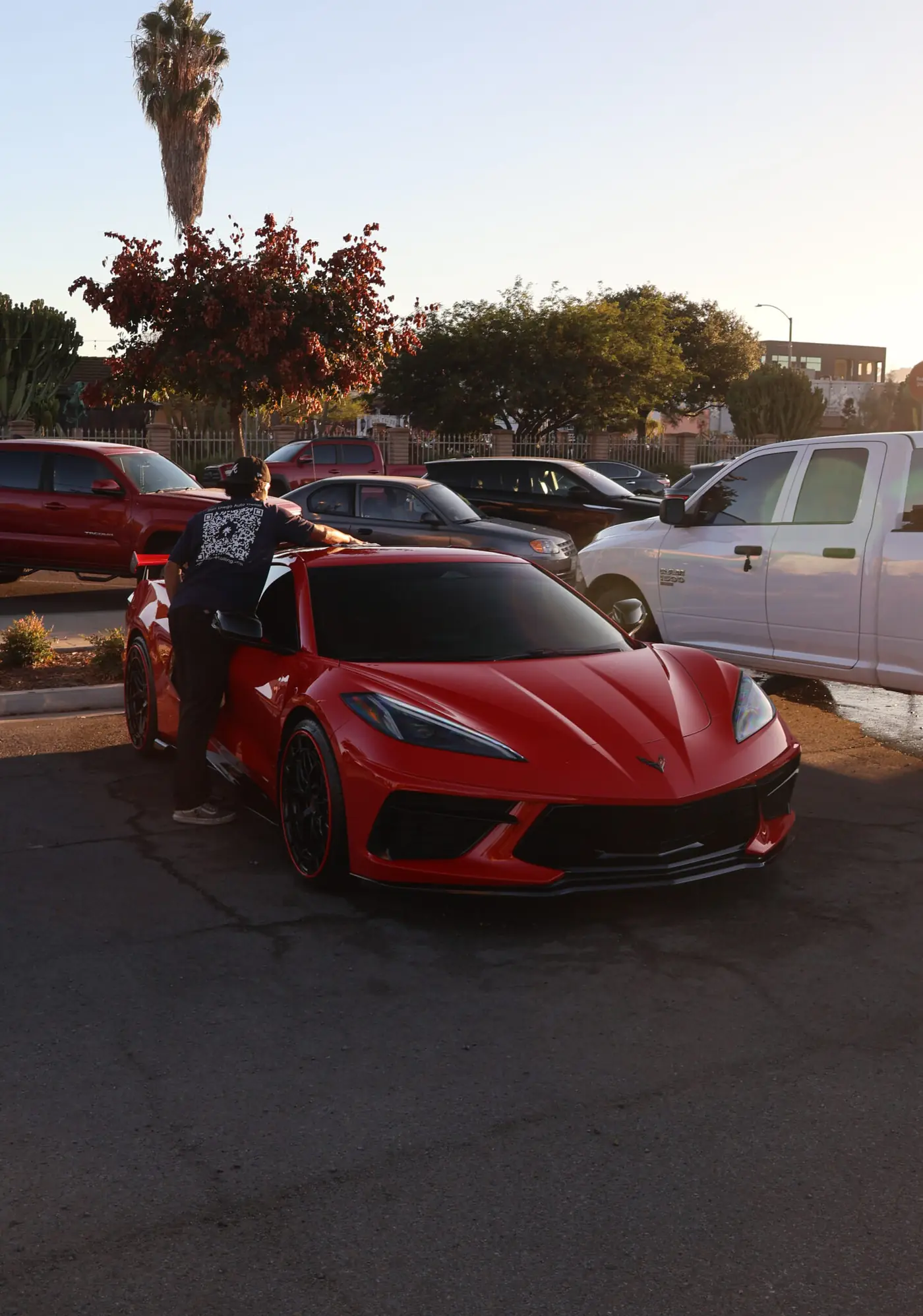 La Mesa paint correction: technician working on the glossy paint of a red Corvette