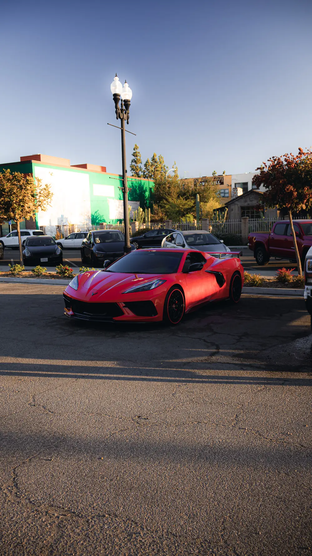 National City paint correction: red Corvette parked in a lot